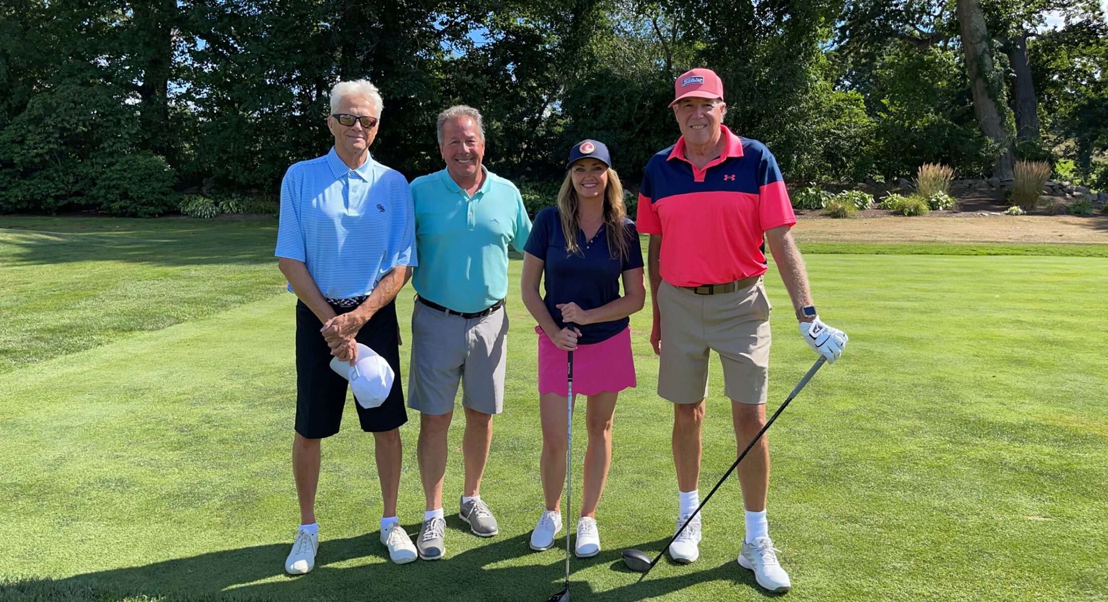 Golfers gathered on the green