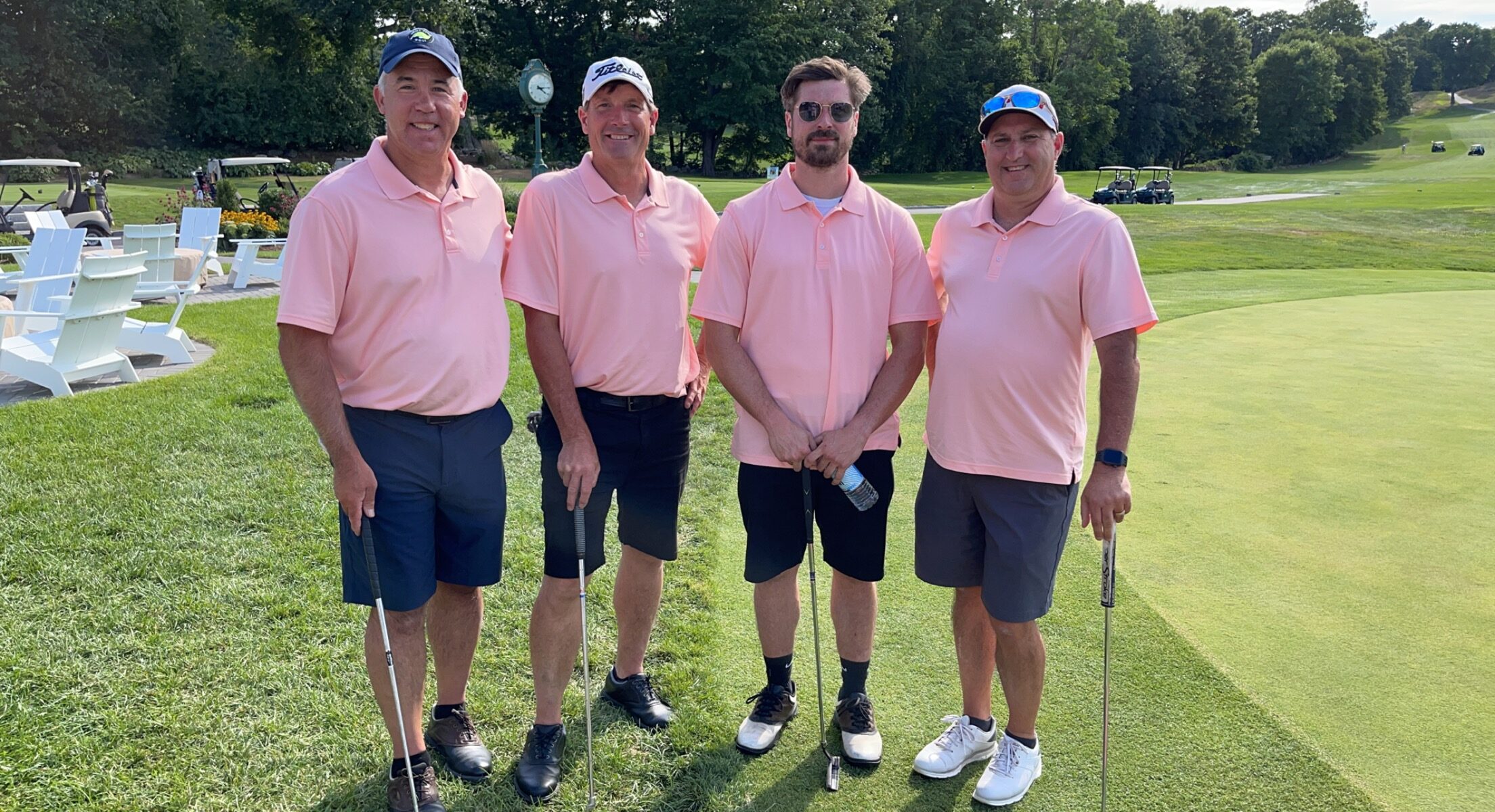 Golf Fore a Cure supporters wearing pink on the course at Framingham Country Club